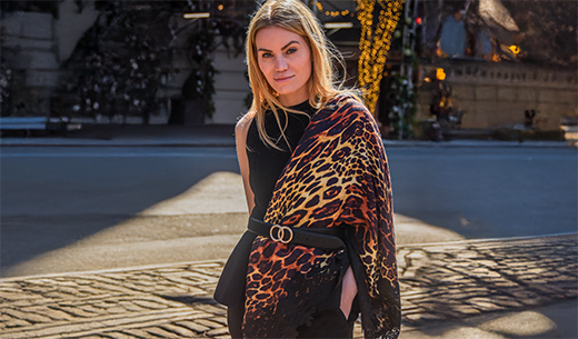 Woman wearing Maneesha Ruia's leopard print wool and silk scarf