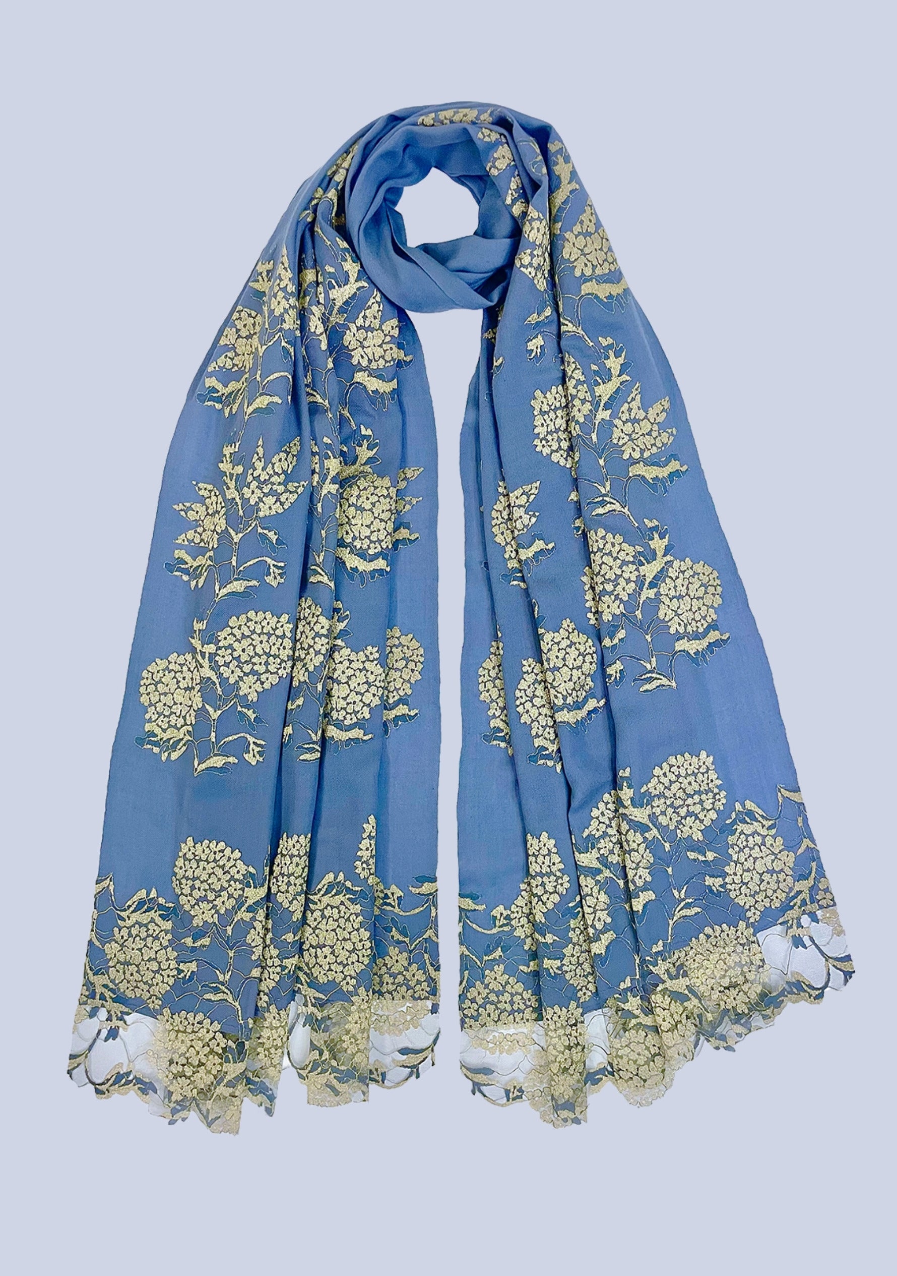 Blue scarf with yellow floral pattern on a light blue background