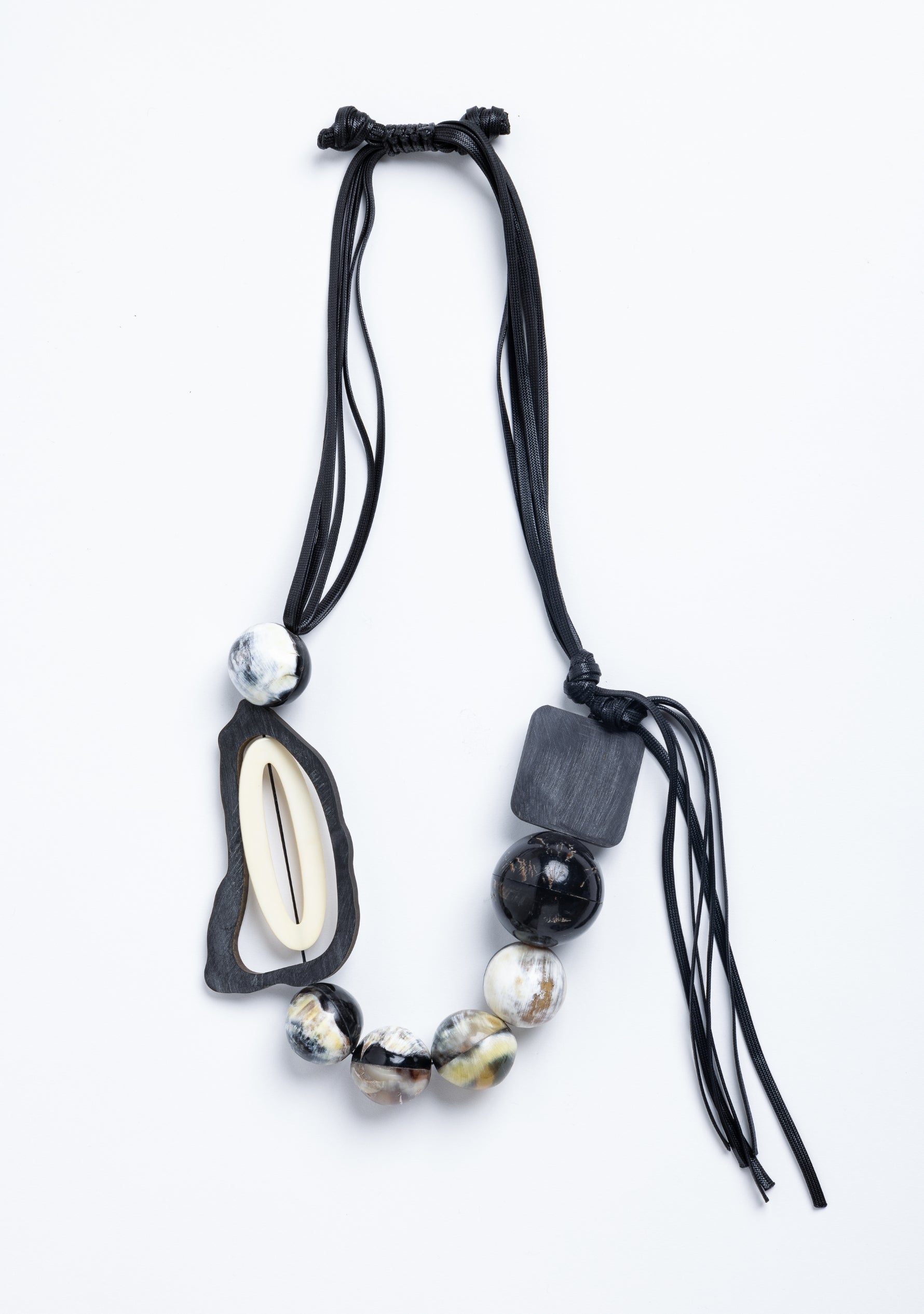 Black Cord Necklace with Black-Natural Buffalo Horn Balls and a White Resin "0"