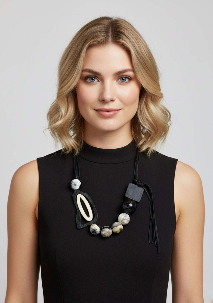 Black Cord Necklace with Black-Natural Buffalo Horn Balls and a White Resin "0" jewelry