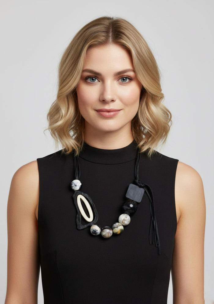 Black Cord Necklace with Black-Natural Buffalo Horn Balls and a White Resin "0" jewelry