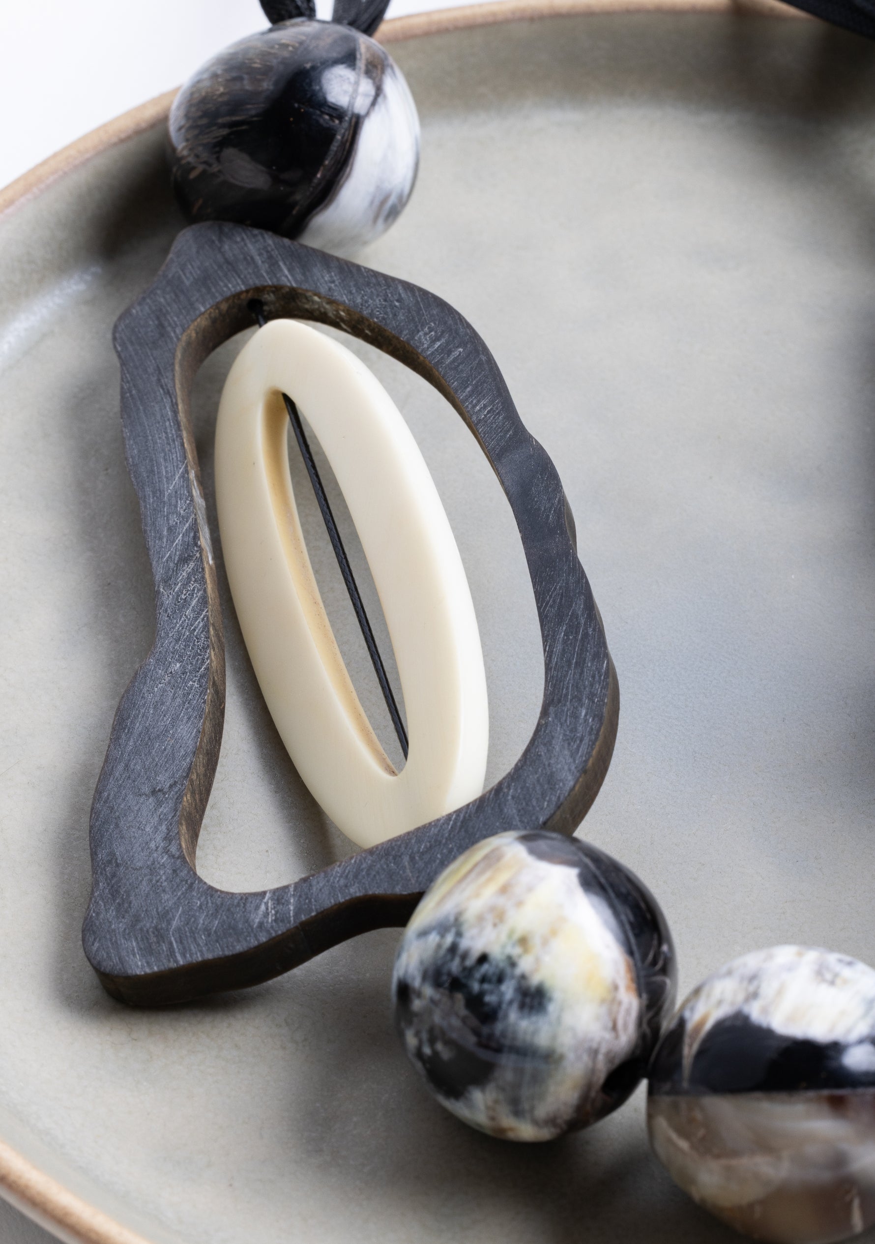 Black Cord Necklace with Black-Natural Buffalo Horn Balls and a White Resin "0"