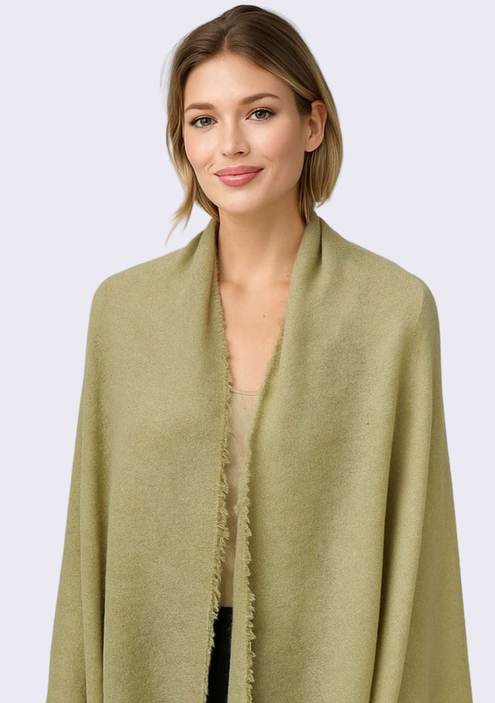 Woman wearing a green scarf on a white background