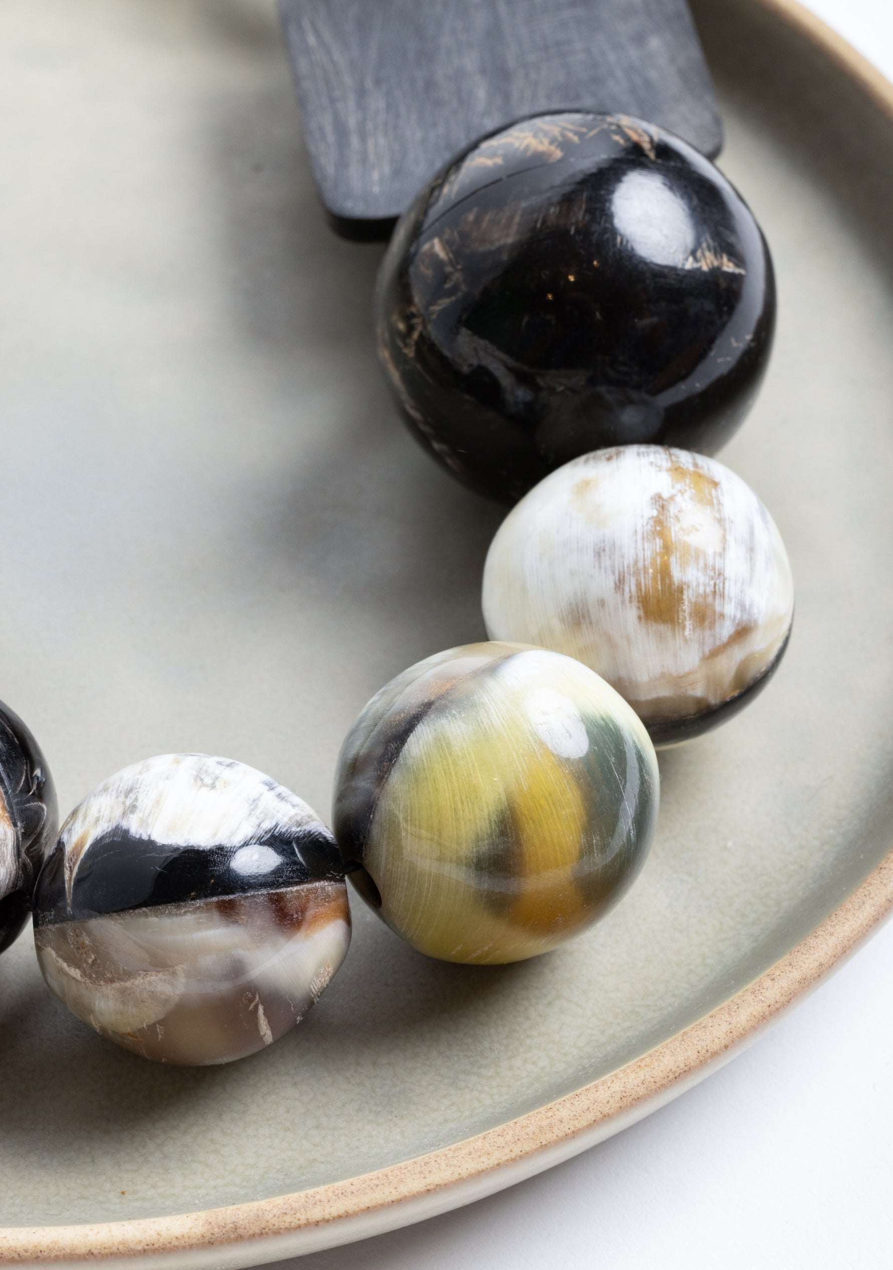 Black Cord Necklace with Black-Natural Buffalo Horn Balls and a White Resin "0" jewelry
