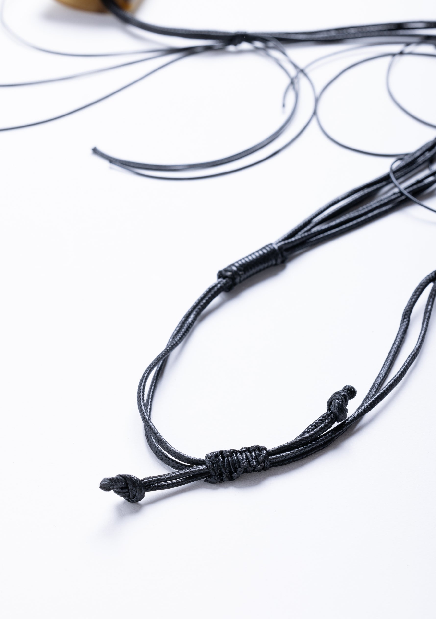 Bunched Black Cord with Dark-Natural-Ivory Buffalo Horn Pendant Necklace