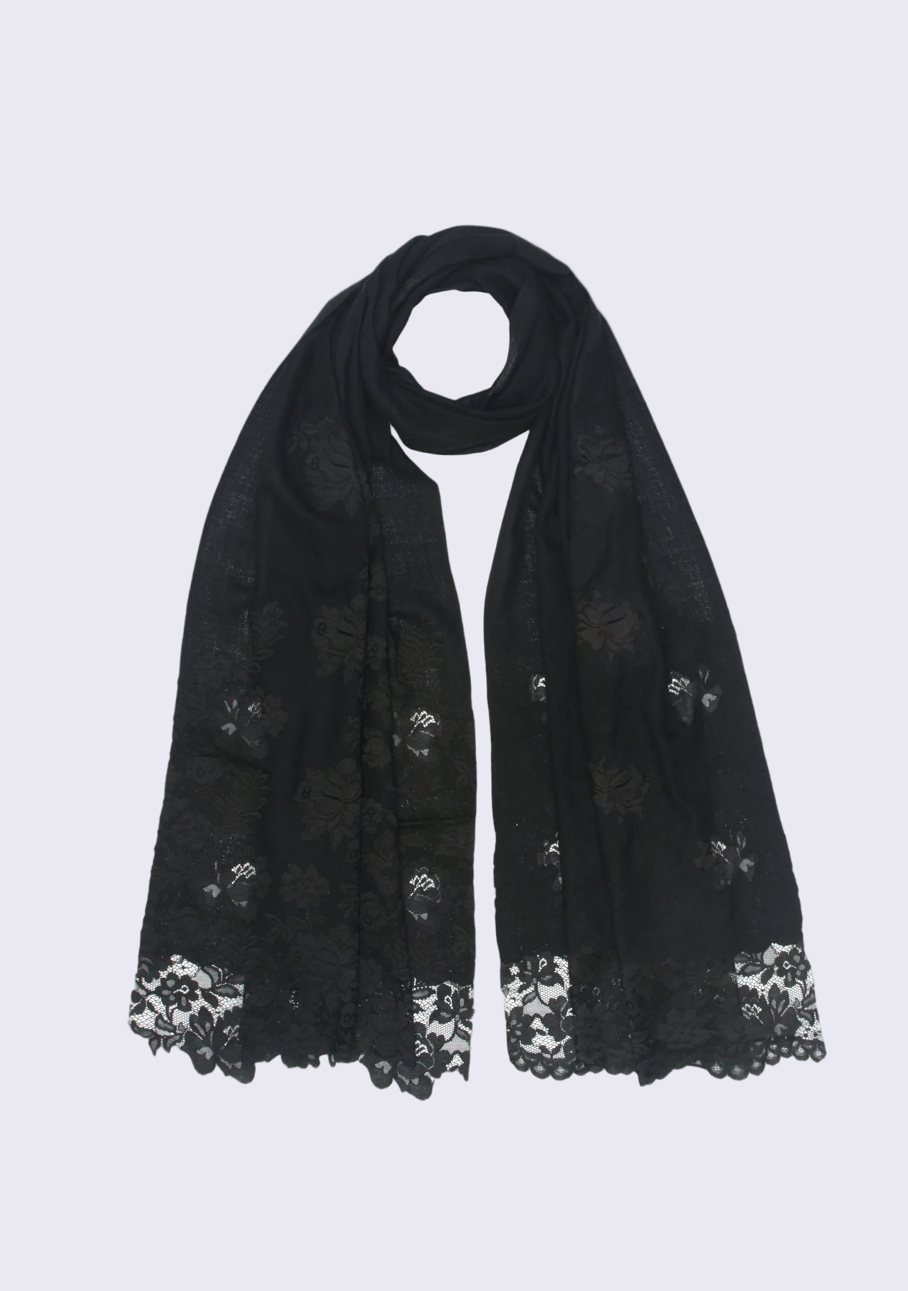 Folded black cashmere scarf with delicate black Chantilly lace, showcasing the premium cashmere fabric and handcrafted floral lace border.