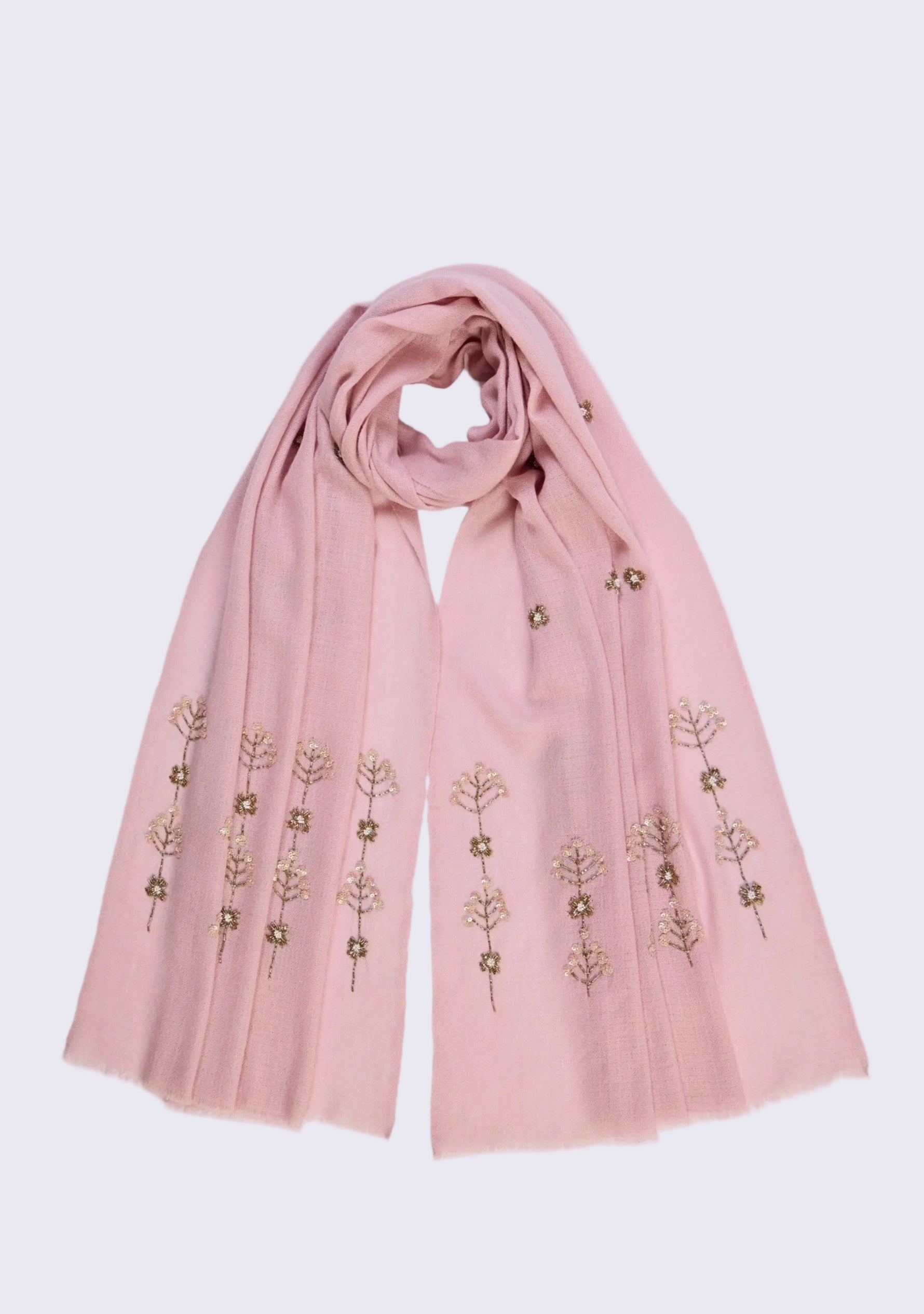 Pink scarf with floral embroidery on a light purple background