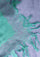 Close-up of the Maneesha Ruia Aqua Ombré Modal & Cashmere Scarf featuring lavender floral lace trim, aqua-to-lavender ombré fabric, and hand-knotted fringes.