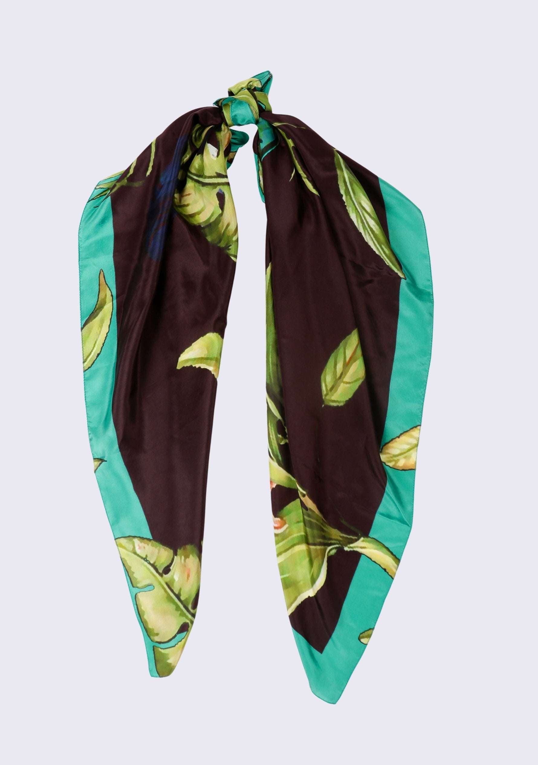 Cockatoo Print Silk Square Scarf by Maneesha Ruia in 100% silk, styled in a chic knot with tropical leaf print, teal border, and elegant designer finish.