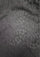 A close-up of a dark gray textured fabric with a lighter gray floral or leafy woven pattern across the surface.