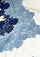 Close-up of a luxury ivory wool and silk scarf featuring handcrafted steel blue and dark denim blue Chantilly floral lace, highlighting the intricate floral lace craftsmanship, rich two-tone detailing, and premium wool-silk fabric.