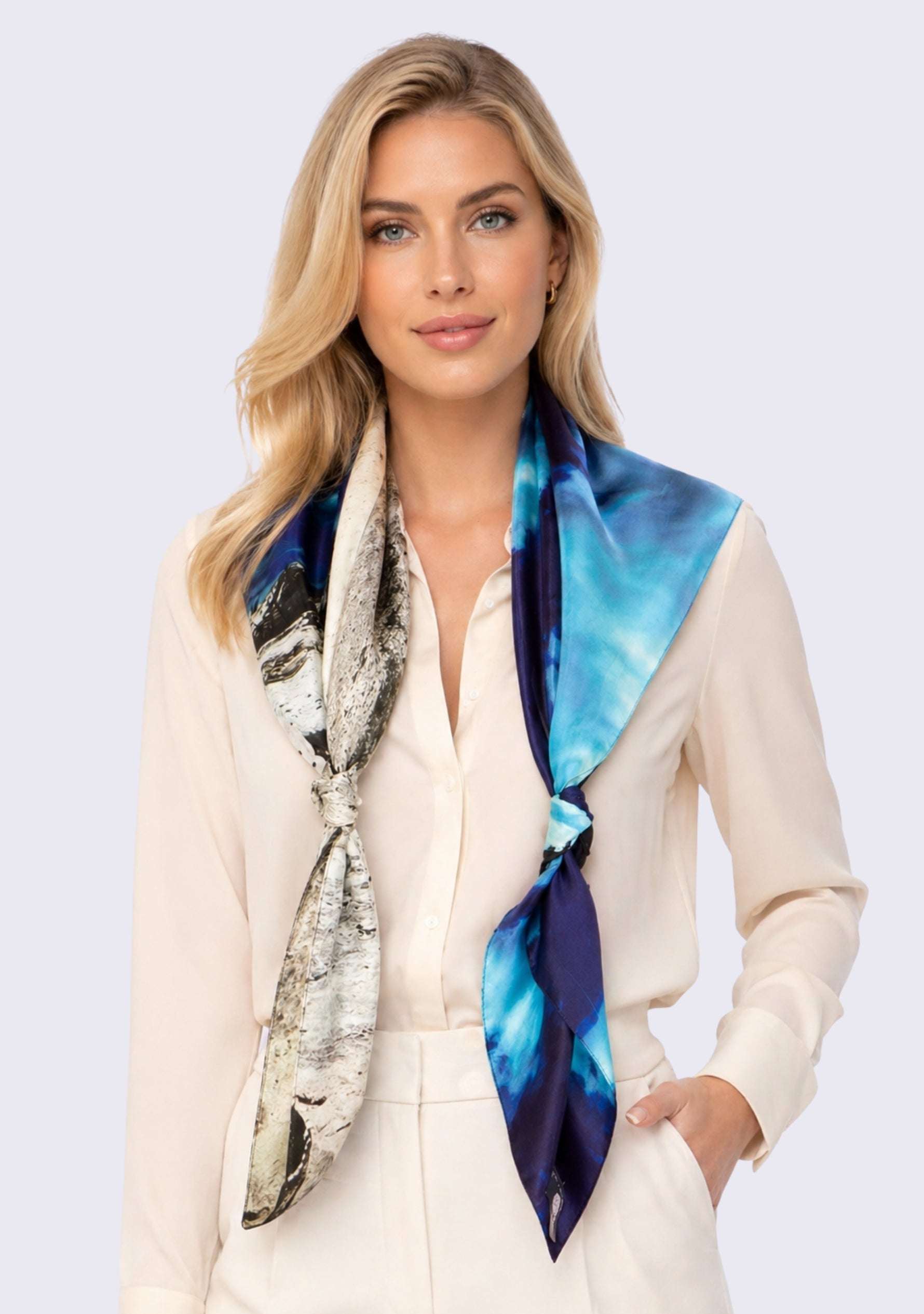 Woman wearing a colorful scarf with a white background