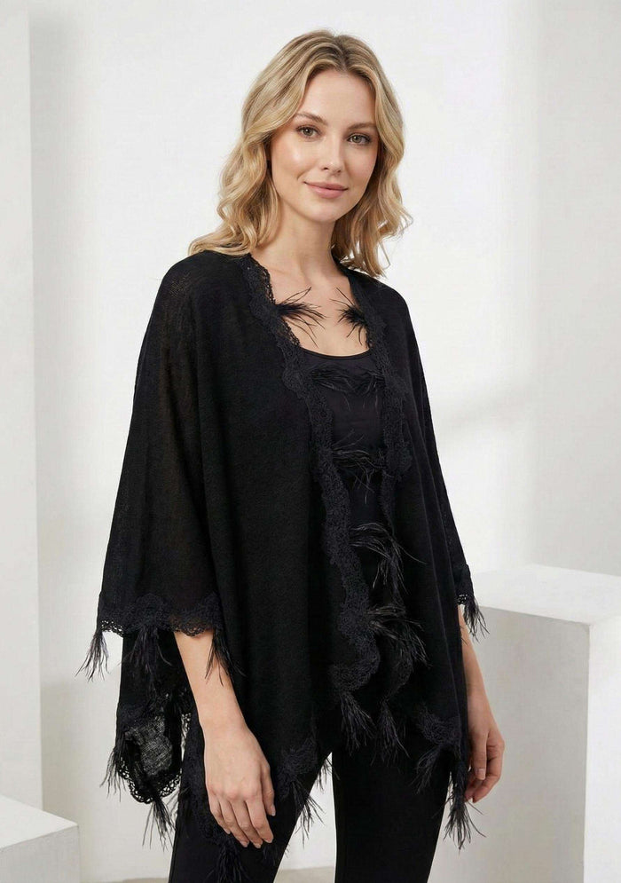 Black knitted merino wool cape with scalloped black lace and ostrich feathers