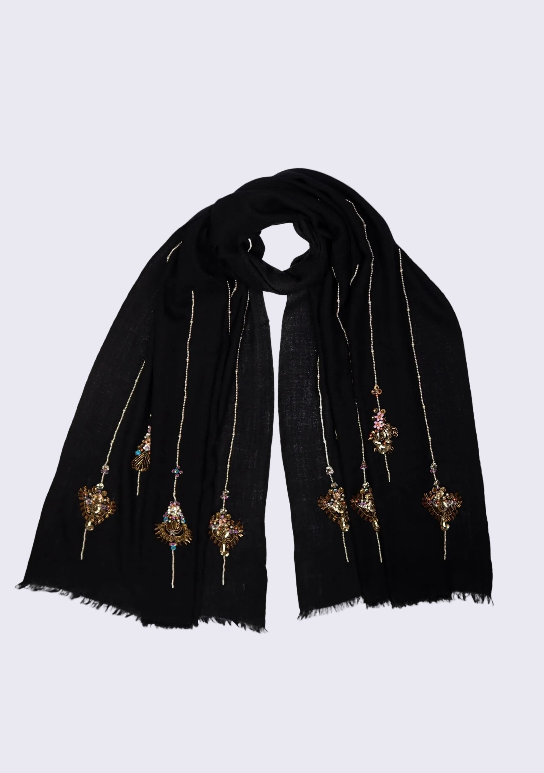 Black scarf with decorative elements on a light gray background