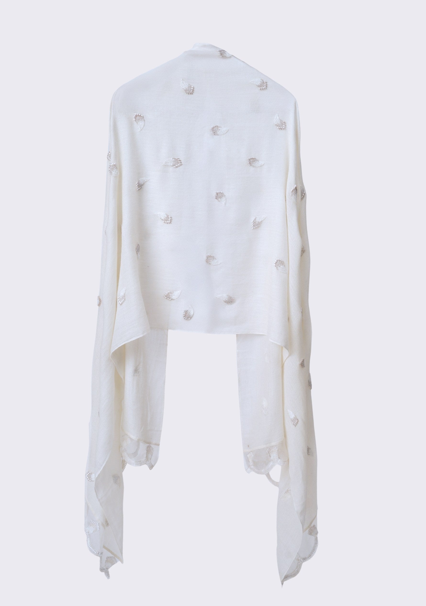 Ivory cashmere scarf featuring a brooch-inspired ivory beaded design, finished with a scalloped organza border and hand-beaded edges