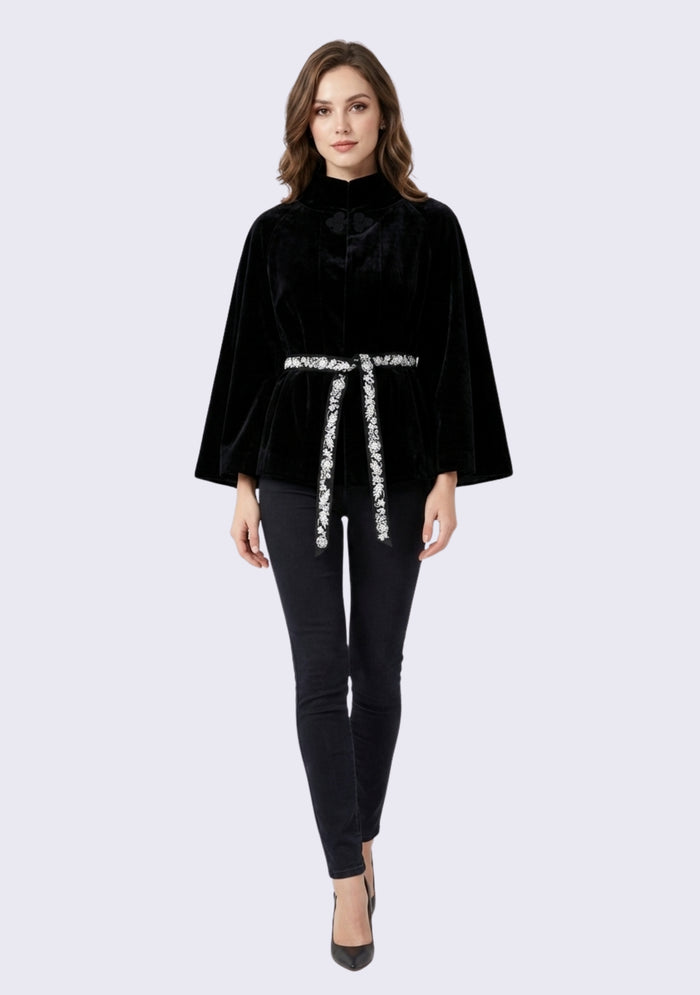 Woman wearing Maneesha Ruia black suede leather jacket with ivory embroidered belt, luxury designer outerwear for women