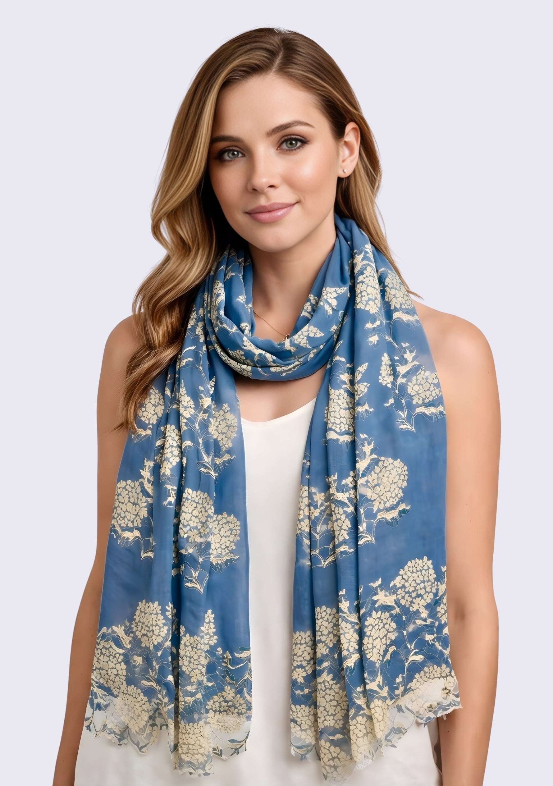 Woman wearing a Maneesha Ruia denim blue wool and silk scarf with gold lace, luxury designer scarf for women