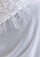 Close-up of a  Maneesha Ruia ivory cashmere scarf with ivory feather and satin appliqué, a luxury designer bridal scarf for women
