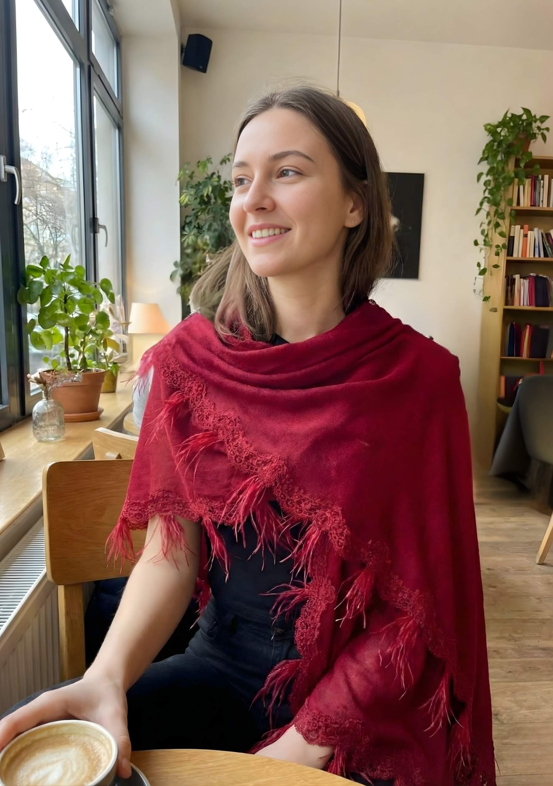 Maneesha Ruia red knitted merino wool cape with scalloped black lace and feathers, luxury designer winter cape