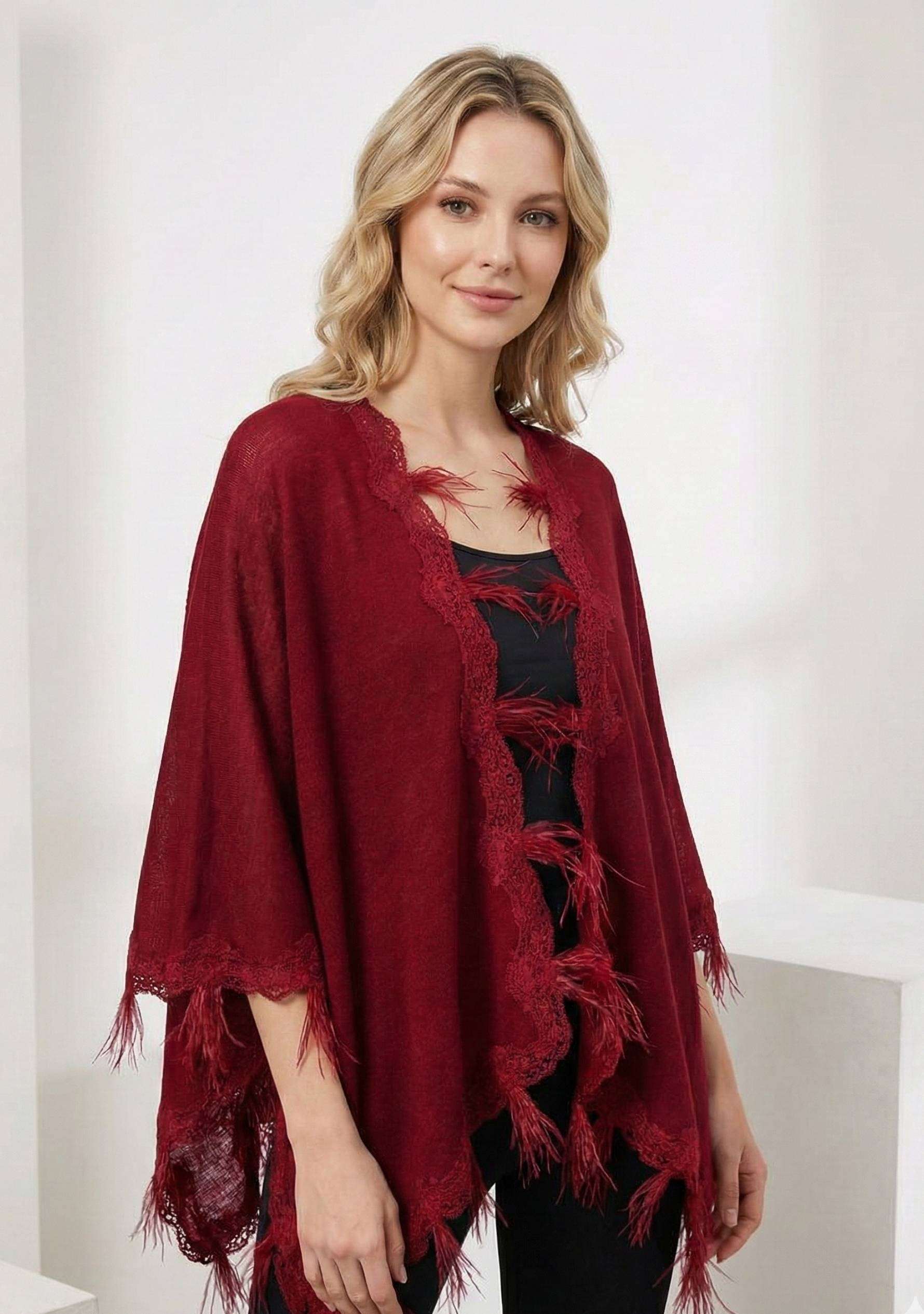 Maneesha Ruia red knitted merino wool cape with scalloped black lace and feathers, luxury designer winter cape