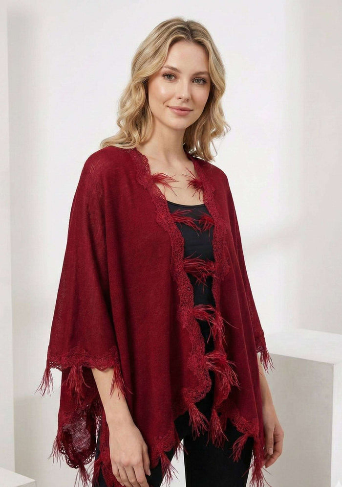 Maneesha Ruia red knitted merino wool cape with scalloped black lace and feathers, luxury designer winter cape