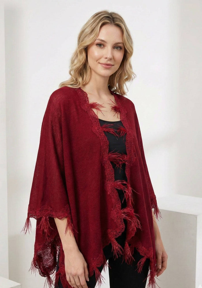 Maneesha Ruia red knitted merino wool cape with scalloped black lace and feathers, luxury designer winter cape