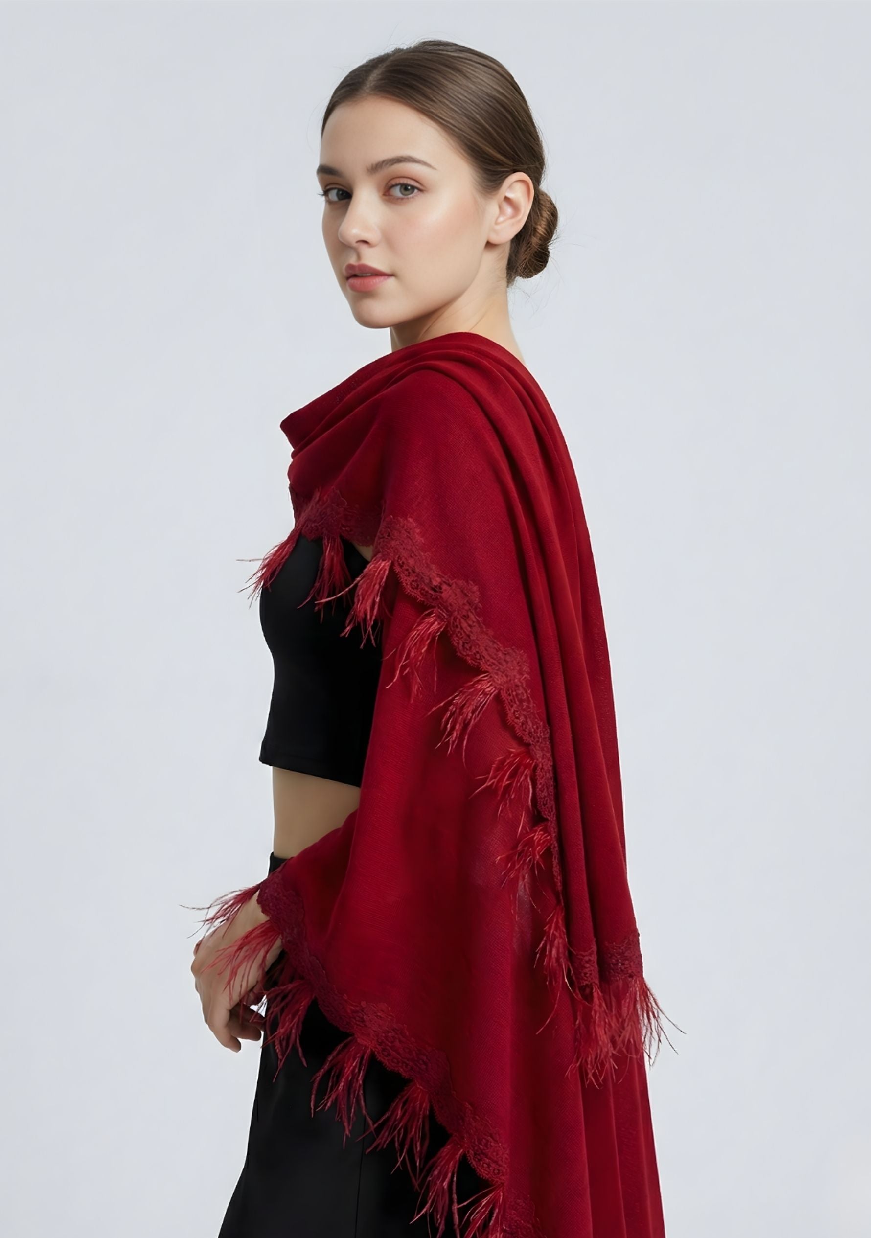 Maneesha Ruia red knitted merino wool cape with scalloped black lace and feathers, luxury designer winter cape
