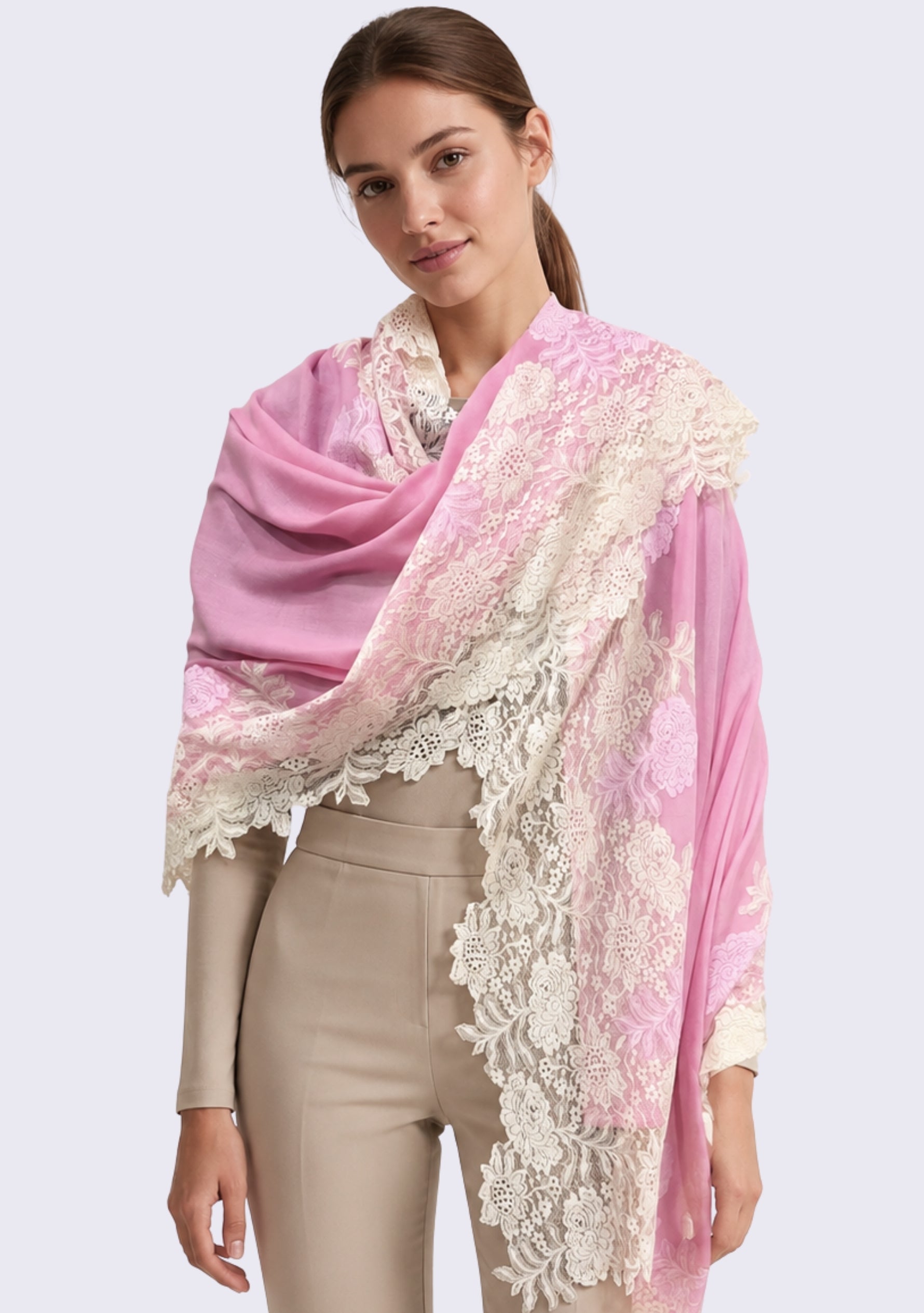 Female model wearing a luxury rose pink wool and silk scarf with handcrafted ivory and soft pink floral lace, elegantly draped over a neutral outfit to showcase its lightweight fabric and intricate floral lace craftsmanship.