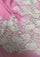 Close-up of a luxury rose pink wool and silk scarf featuring handcrafted ivory and soft pink Chantilly floral lace, highlighting the intricate floral lace craftsmanship, delicate detailing, and premium wool-silk fabric.
