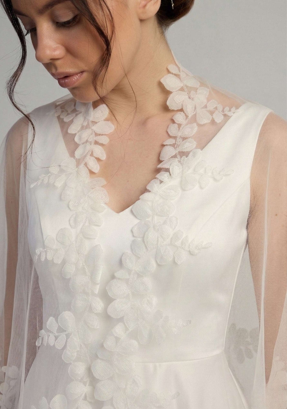 White floral lace dress with a plain background